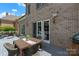 Outdoor dining space on a deck with a view of the backyard at 6132 Sharon Rd, Charlotte, NC 28210