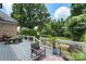 Spacious deck with outdoor seating area perfect for enjoying the serene backyard view at 6132 Sharon Rd, Charlotte, NC 28210