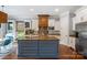 Beautiful kitchen with custom cabinets, island with seating, and stainless steel appliances at 6132 Sharon Rd, Charlotte, NC 28210