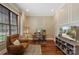 Comfortable home office with detailed trimwork, chair, desk and natural light at 6132 Sharon Rd, Charlotte, NC 28210