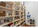 Spacious walk-in pantry with ample shelving for organized storage at 6132 Sharon Rd, Charlotte, NC 28210