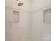 Modern walk-in shower with white subway tiles and mosaic tile accents at 6132 Sharon Rd, Charlotte, NC 28210