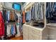 Well-organized walk-in closet with custom shelving and drawers at 6132 Sharon Rd, Charlotte, NC 28210