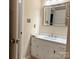 A bathroom featuring a granite vanity top and undermount sink, providing a luxurious feel at 7212 Bradley Ct, Charlotte, NC 28227