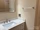 Bathroom featuring a granite vanity top and undermount sink at 7212 Bradley Ct, Charlotte, NC 28227