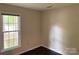 Bedroom with hardwood floors and a window providing natural light at 7212 Bradley Ct, Charlotte, NC 28227