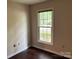 This bedroom features a large window and neutral walls, creating a bright and inviting space at 7212 Bradley Ct, Charlotte, NC 28227