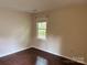 Bedroom with hardwood floors and neutral paint at 7212 Bradley Ct, Charlotte, NC 28227