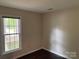 Bedroom with hardwood floors and a window providing natural light at 7212 Bradley Ct, Charlotte, NC 28227
