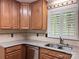 Bright kitchen featuring granite countertops, stainless steel appliances, and ample cabinet space at 7212 Bradley Ct, Charlotte, NC 28227