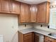 Updated kitchen with granite countertops and stainless steel dishwasher, offering a modern culinary space at 7212 Bradley Ct, Charlotte, NC 28227