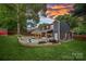 Backyard with a cozy covered patio, in-ground pool and privacy fence at 8007 Maxwelton Dr, Huntersville, NC 28078