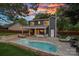 The backyard features a pool, patio area for entertaining, and a privacy fence at 8007 Maxwelton Dr, Huntersville, NC 28078