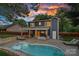Backyard pool with a cozy covered patio with outdoor seating at 8007 Maxwelton Dr, Huntersville, NC 28078