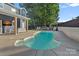 Inviting backyard featuring a pool, patio, and outdoor kitchen at 8007 Maxwelton Dr, Huntersville, NC 28078