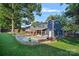 Spacious backyard with a pool, patio, and outdoor grill at 8007 Maxwelton Dr, Huntersville, NC 28078