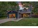 Charming home boasts curb appeal with a well-manicured lawn and inviting front porch at 8007 Maxwelton Dr, Huntersville, NC 28078