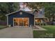 Charming two-story home with blue siding, a welcoming porch, and a well lit front window at 8007 Maxwelton Dr, Huntersville, NC 28078