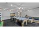 Spacious game room featuring a pool table, string lights, and comfortable seating area, perfect for entertaining at 8007 Maxwelton Dr, Huntersville, NC 28078