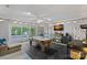 Entertaining game room with a pool table, bar area, and large sliding glass doors for natural light at 8007 Maxwelton Dr, Huntersville, NC 28078