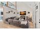 Bright and airy living room features a fireplace and a large sectional sofa at 8007 Maxwelton Dr, Huntersville, NC 28078