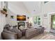 Cozy living room with a fireplace and large sectional sofa at 8007 Maxwelton Dr, Huntersville, NC 28078