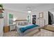 Cozy main bedroom with a comfortable king-size bed, stylish decor, and ample natural light at 8007 Maxwelton Dr, Huntersville, NC 28078