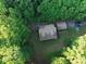 Aerial view of a wooded property with the home nestled among the trees at 95 Odell Ct, Taylorsville, NC 28681