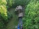 Aerial view showcasing home and property nestled among the trees at 95 Odell Ct, Taylorsville, NC 28681