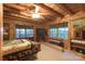 Comfortable bedroom with wood accents, ample natural light, and cozy furnishings at 95 Odell Ct, Taylorsville, NC 28681