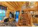 Warm entryway featuring wood stairs, decorative accents, and a convenient coat rack at 95 Odell Ct, Taylorsville, NC 28681