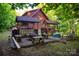 Exterior view of home with covered swings and fire pit area at 95 Odell Ct, Taylorsville, NC 28681