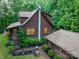 Lovely exterior view of log cabin home with manicured landscaping at 95 Odell Ct, Taylorsville, NC 28681