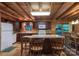 Well-equipped kitchen featuring wood cabinetry, an island, and a dining area for casual meals at 95 Odell Ct, Taylorsville, NC 28681