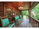 Inviting covered porch with rocking chairs and rustic charm, perfect for enjoying the outdoors at 95 Odell Ct, Taylorsville, NC 28681