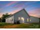 Backyard featuring vinyl siding and a small patio at 102 W Georgia Ave, Bessemer City, NC 28016