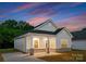 Charming single-story home with a cozy front porch, perfect for enjoying sunsets at 102 W Georgia Ave, Bessemer City, NC 28016