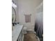 Bathroom with black hardware, tiled floor, and black and white shower curtain at 103 Doyle Farm Ln, Mooresville, NC 28115