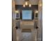 Luxurious soaking tub between two vanities in large bath area at 103 Doyle Farm Ln, Mooresville, NC 28115