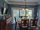 Charming dining room with sliding glass doors, wood floors, and ample natural light at 103 Doyle Farm Ln, Mooresville, NC 28115