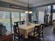 Bright dining room features a sliding glass door that provides access to the backyard at 103 Doyle Farm Ln, Mooresville, NC 28115