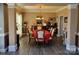 Formal dining room featuring classic furnishings, chandelier, and neutral color palette for elegant entertaining at 103 Doyle Farm Ln, Mooresville, NC 28115