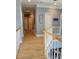 Upstairs hallway with wood floors and a view of the staircase at 103 Doyle Farm Ln, Mooresville, NC 28115