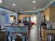 Open kitchen with modern appliances, granite countertops, and a breakfast bar, perfect for Gathering gatherings at 103 Doyle Farm Ln, Mooresville, NC 28115