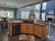 Well-appointed kitchen with wood cabinets, black appliances and stone countertops at 103 Doyle Farm Ln, Mooresville, NC 28115