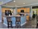 Bright kitchen area featuring light wood cabinets, blue walls and an open plan at 103 Doyle Farm Ln, Mooresville, NC 28115