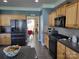 Well-equipped kitchen featuring stainless steel appliances and ample counter space; perfect for culinary enthusiasts at 103 Doyle Farm Ln, Mooresville, NC 28115