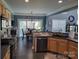 Spacious kitchen with stainless steel appliances and an adjacent dining area at 103 Doyle Farm Ln, Mooresville, NC 28115