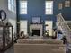Cozy living room with a fireplace, lots of natural light, and a comfortable seating area at 103 Doyle Farm Ln, Mooresville, NC 28115