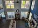 Spacious living room with high ceilings, large windows, and a fireplace, offering a bright and airy atmosphere at 103 Doyle Farm Ln, Mooresville, NC 28115
